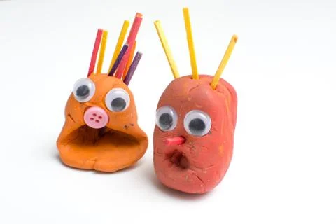 Fun modelling clay figures with shocked expression on isolated white backgrou Stock Photos