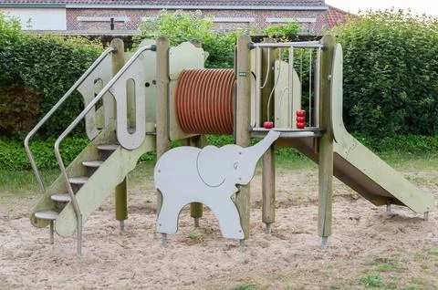 A fun playground featuring an elephant shaped slide along with stairs Stock Photos