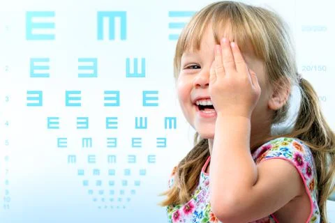Fun portrait of kid testing vision. Stock Photos