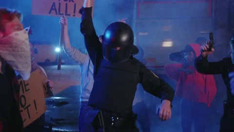 Fun protest. Funny and sexy police officers dancing in middle of energetic crowd Stock Footage 133287191