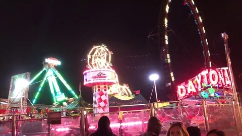 Fun rides glowing in dark at fair Stock-Footage 73430483