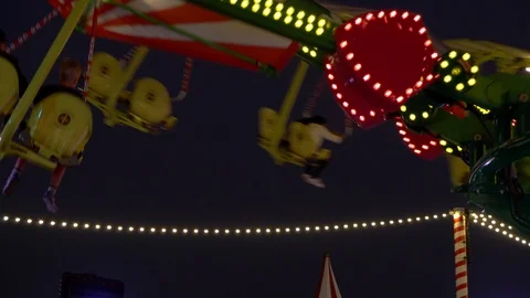 Fun rides in the park in the evening Stock Footage 100721600