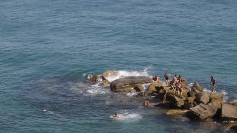 Fun on the rocks at the seaside. Stock Footage 316695255