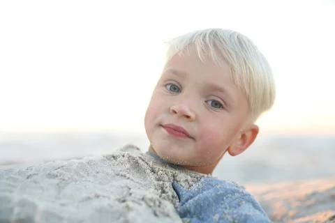 Fun in the sand on the beach Stock Photos