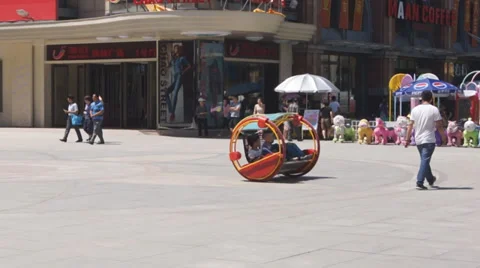 Fun self-propelled rocking bench. Chinese city of Harbin Stock Footage 27817032