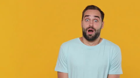 Fun shocked surprised young man 20s years old in basic casual blue t-shirt Video stock 148289492