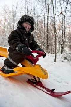Fun on snow sledge Stock Photos
