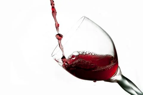 Fun spirts splash pour action red wine glass celebration party lifestyle happy Foto stock