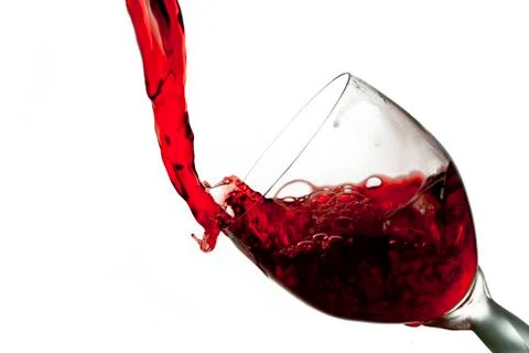 Fun spirts splash pour action red wine glass celebration party lifestyle happy Foto stock