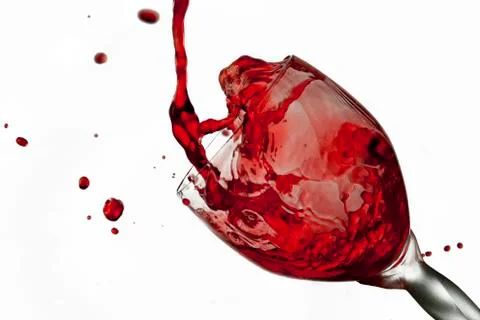 Fun spirts splash pour action red wine glass celebration party lifestyle happy Foto stock