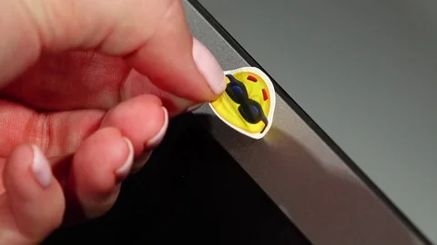 Fun sticker removed from laptop camera, webcam become open for usage Video stock 71620238