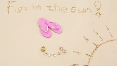 Fun in the sun stop motion on white beach sand (tropical island) with hat, flip Stock Footage 143676685