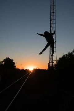 Fun sunset, climb to the iron rust escalator Stock Photos