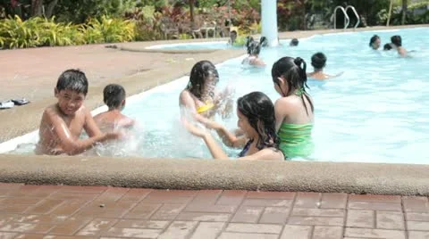 Fun At The Swimming Pool Stock Footage 10883268