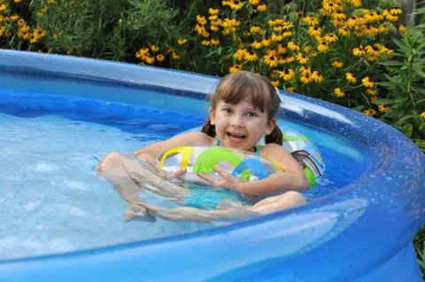 Fun in a swimming pool Stock Photos
