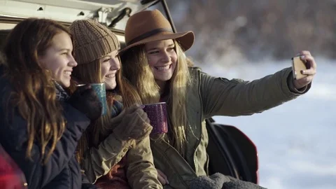 Fun Teens Take Selfies From Back Of SUV, Warm Up With Blankets And Hot Cocoa Stock-Footage 72272757