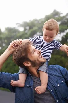 Fun times with Dad. Shot of young father and his baby boy enjoying a day outside Stock Photos