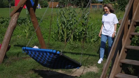 Fun times at the playground. Single mom with twin babies having enjoying large Video stock 141106045