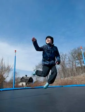 Fun on trampolin at springtime Stock Photos