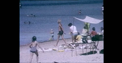 Fun in the Water at the Beach Australia 1970s Stock Footage 317880337