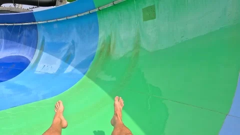 Fun on the water slide in aqua park Stock Footage 282372037