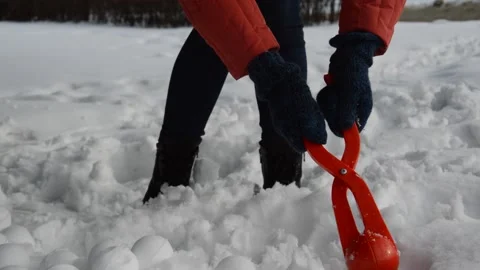 Fun winter games in the snow, modeling snowballs. Stock Footage 172065298
