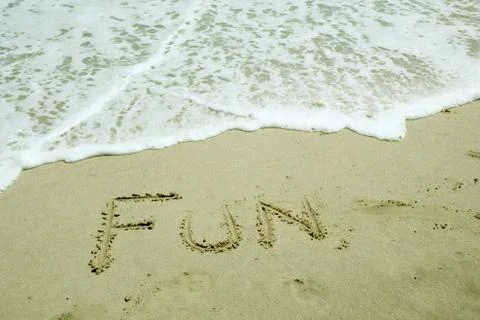 Fun written on beach Stock Photos