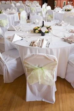 A function room layed out for a wedding. Stock Photos