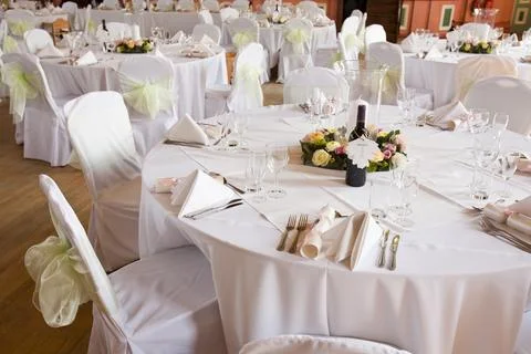 A function room layed out for a wedding. Stock Photos