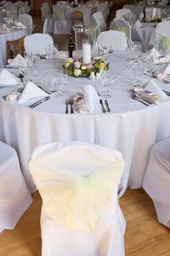 A function room layed out for a wedding. Stock Photos