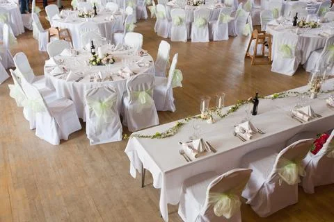 A function room layed out for a wedding. Stock Photos