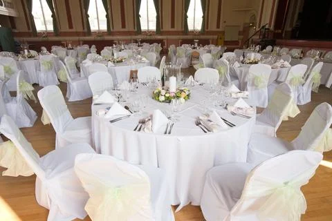 A function room layed out for a wedding. Stock Photos