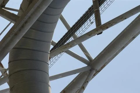 Functional ventilation system with rivets and brackets against sky 写真素材