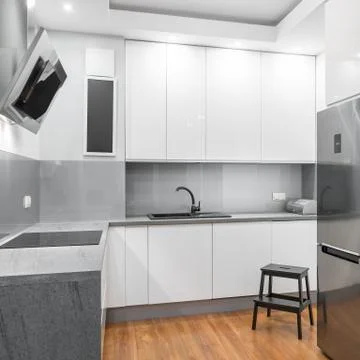 Functional white kitchen Stock Photos