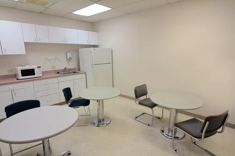 Functional Workplace Break Room with Kitchenette and Seating Area 스톡 사진