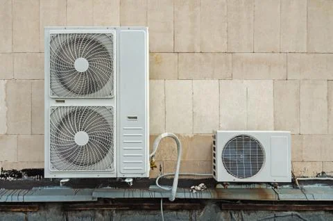 Functioning air conditioner on flat roof Stock Photos