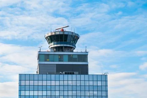 Functioning airport control tower with transparent booth. Air transport command Stock Photos