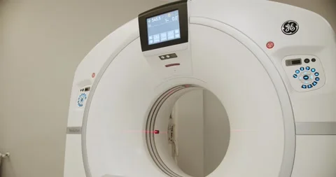 Functioning MRI machine in a medical room. Modern CT machine in clinic. 動画素材 229719990