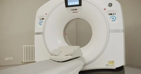 Functioning MRI machine in a medical room. Modern CT machine in clinic. Video stock 260479980