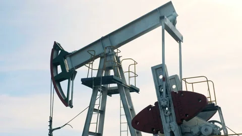 Functioning oil-derrick during working process. Working oil pumps, oil rigs on a Video stock 98171620