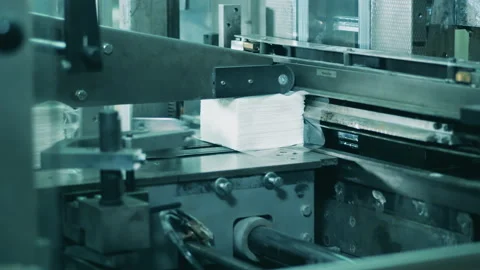 Functioning paper tissue cutting machine at a factory Video stock 146574339