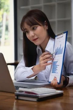 Fund managers researching and analysis Investment stock market meeting with her Stock Photos