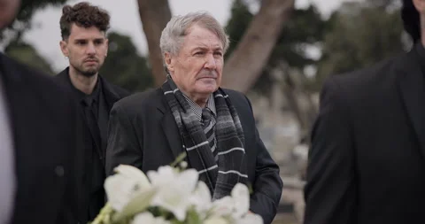 Funeral, death and senior man carry coffin with family in grief, mourning and Stock Footage 249087553