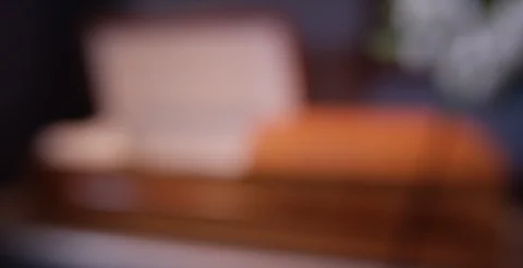 Funeral home rack focus to empty casket Stock Footage 108515024
