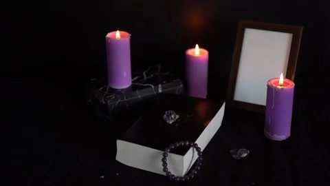Funeral, photo frame, candles, marble urn for ashes, holy bible and spiritu.. Stock Footage 301781553