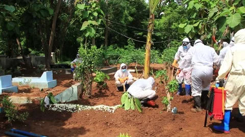 The funeral process of a corpse infected with the corona virus Stock Footage 142816228