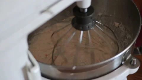 Funfetti cake batter being whisked together in a metal KitchenAid mixing Stock Footage 150341871