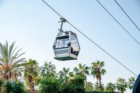 Funicular cab on background of sky and palm trees Stock Photos