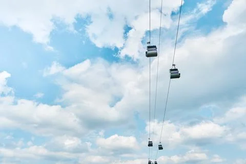 Funicular cabin or Cable car on blue sky clouds background. Sky lift. Cable t Stock Photos