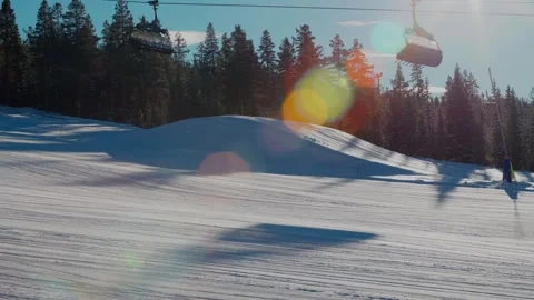 Funicular cabins, trees in the snow, sun rays and sparkling snow Stock Footage 301818977